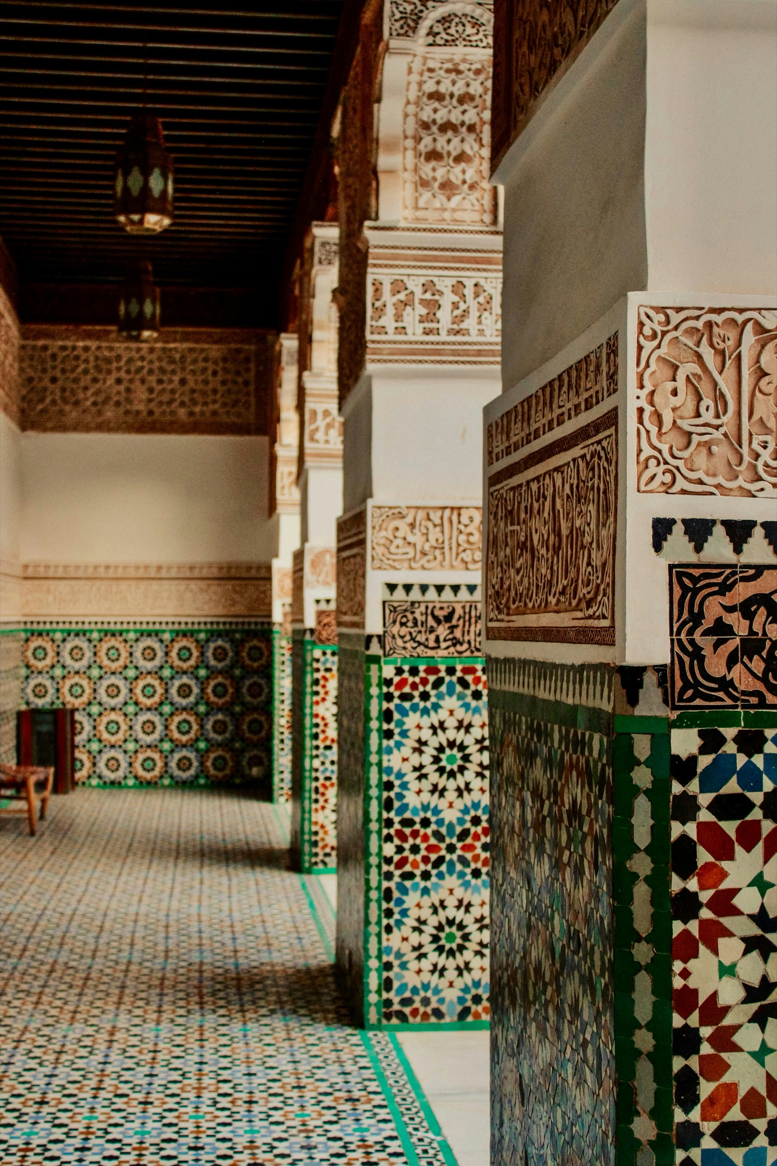 Stacks of coloured zellige tiles in a Marrakech workshop